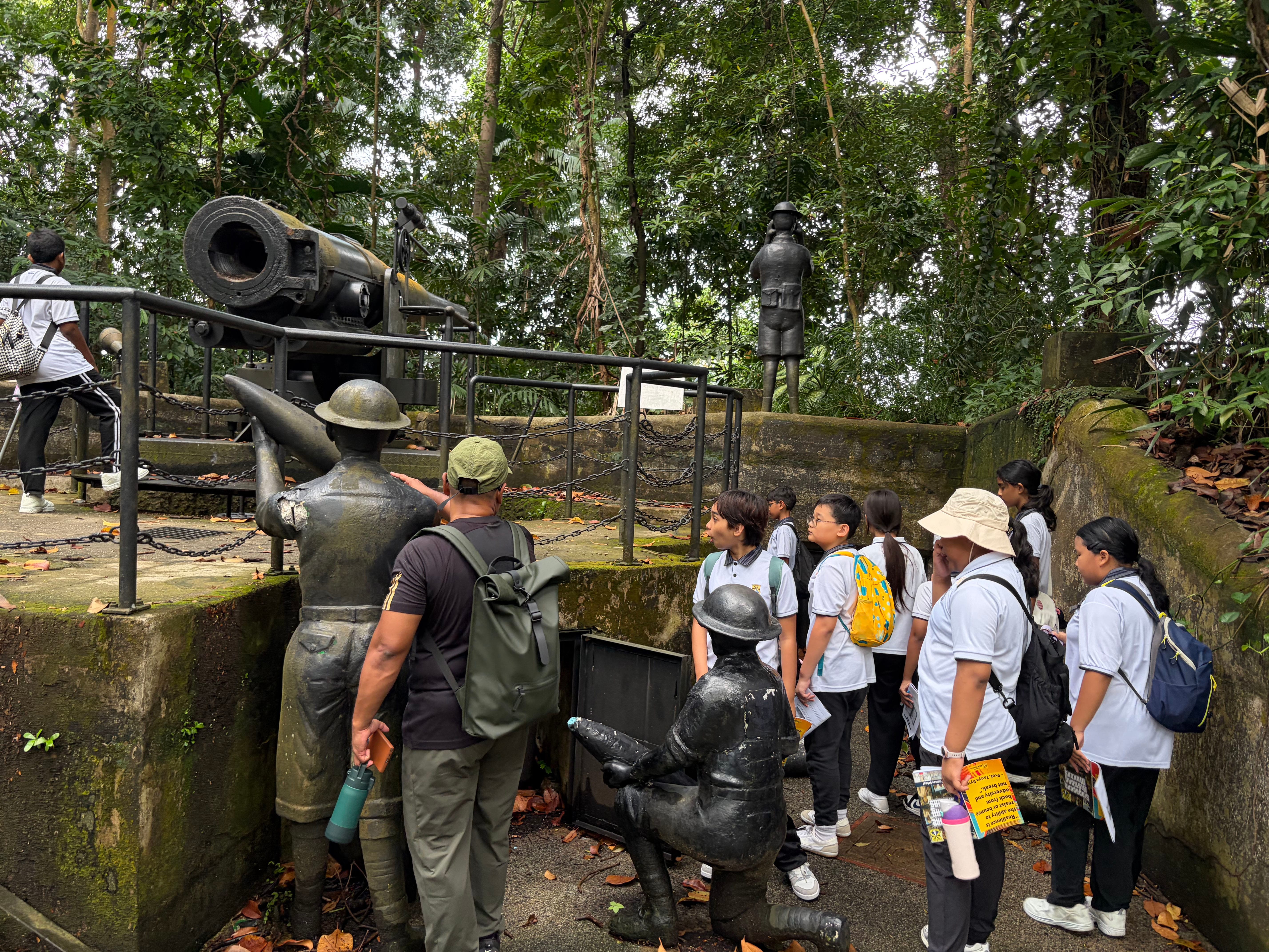Students pause along a heritage trail to learn about Singapore's history, connecting classroom lessons to real places.